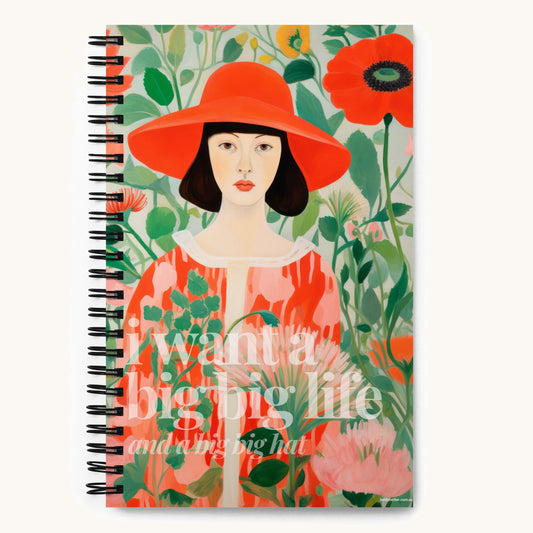 I Want a Big Big Life (And a Big Big Hat) Betty Better spiral notebook with a painted woman in a huge red hat among poppies on the cover